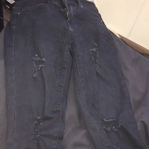 Black jeans with rips in them